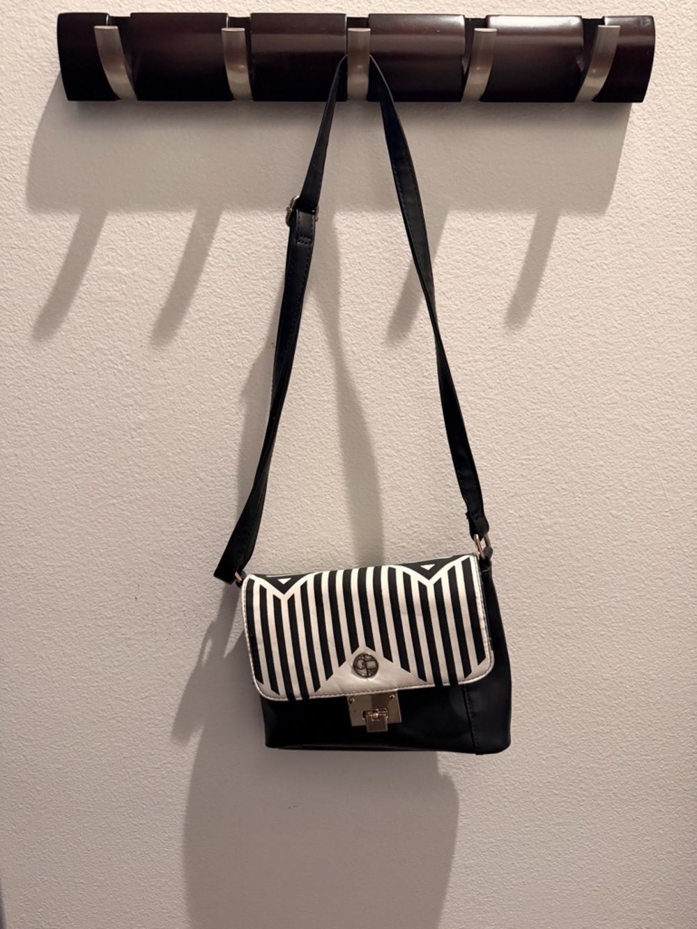 Black & White Striped Crossbody Bag with Turn-Lock Closure